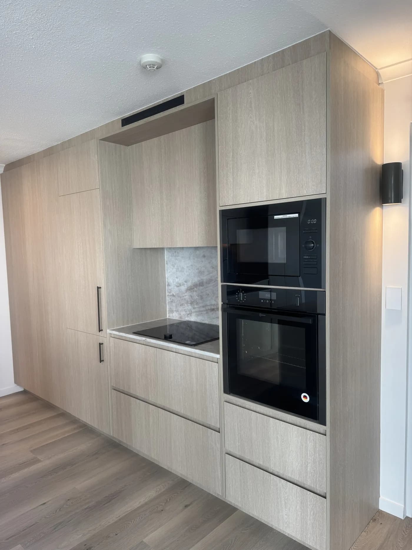 Apartment kitchen appliances splashback — Apartment Renovation, Gold Coast