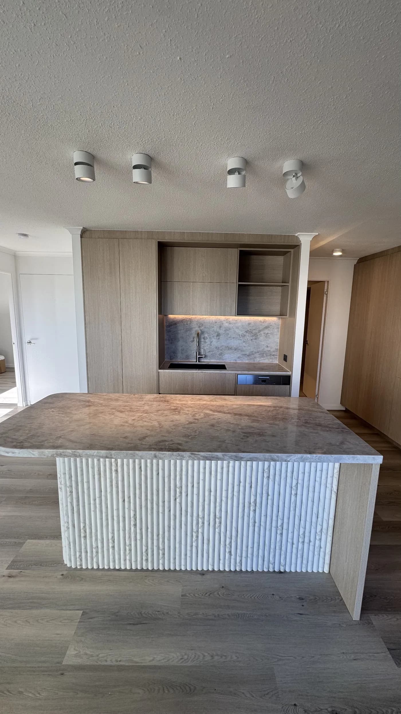 Apartment kitchen stone waterfall island — Apartment Renovation, Gold Coast