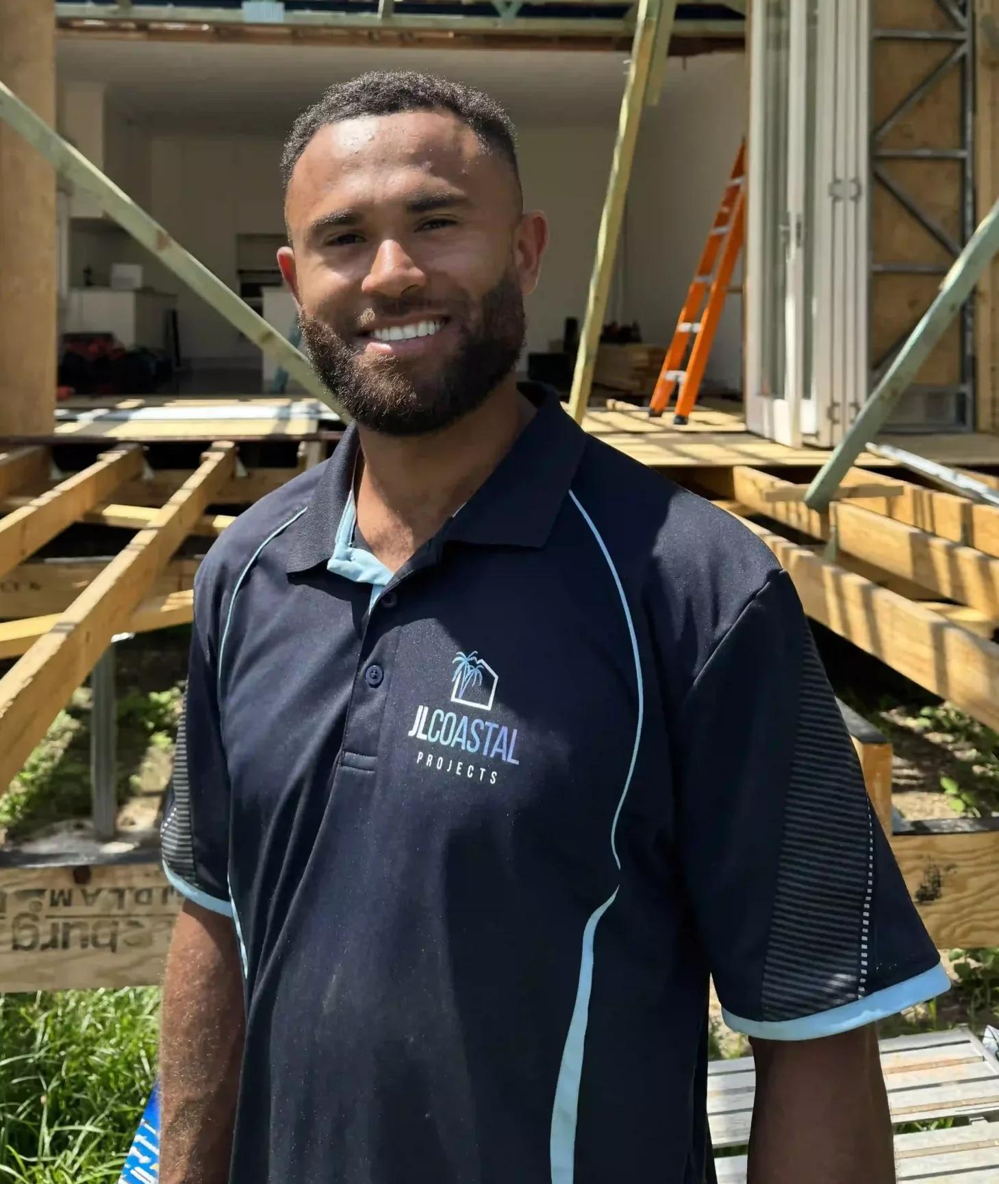 Matt Little, professional builder and co-owner of JL Coastal Projects, wearing company uniform at Gold Coast construction site