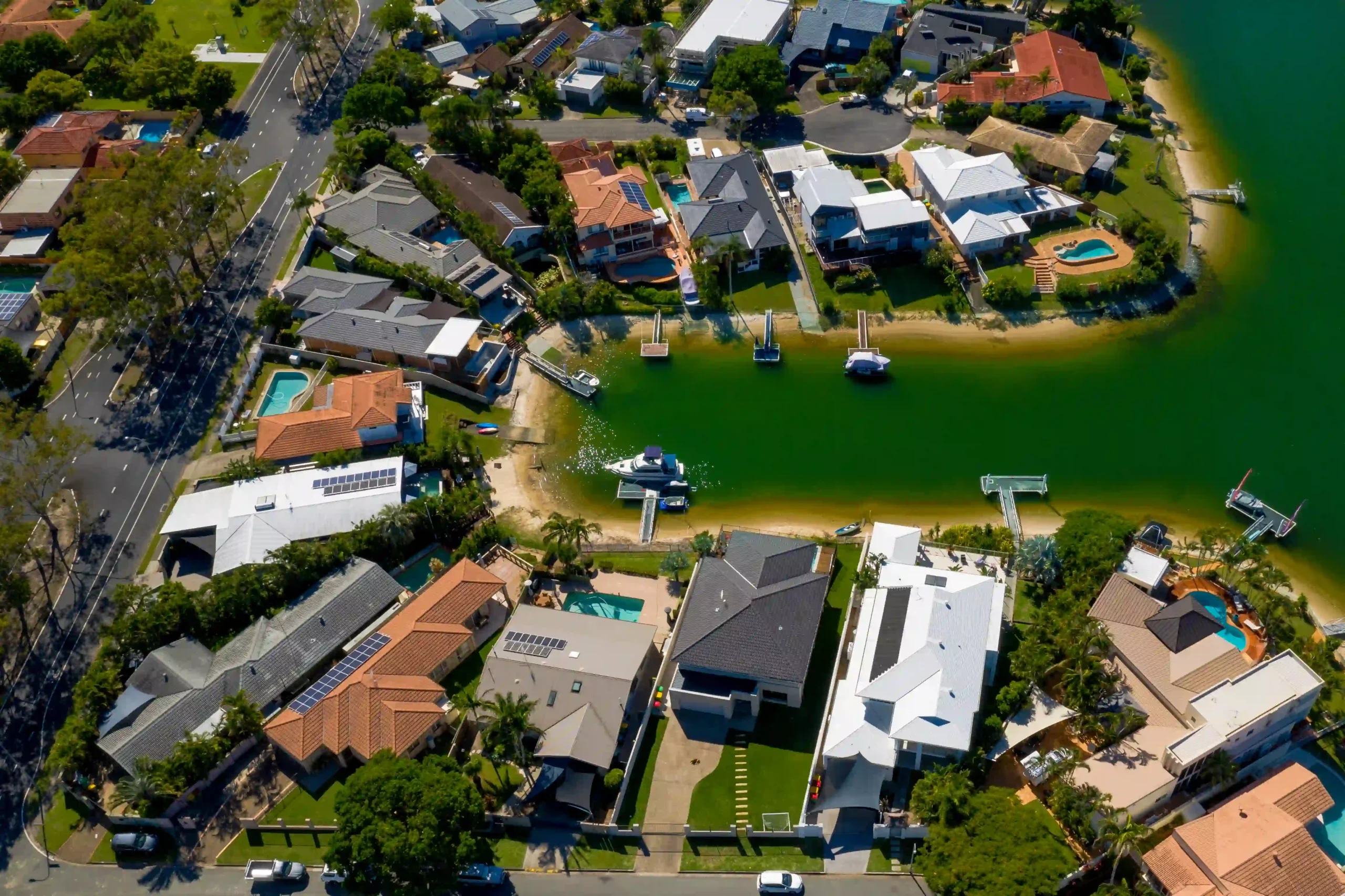 Aerial view of waterfront residential properties in Broadbeach with private docks.