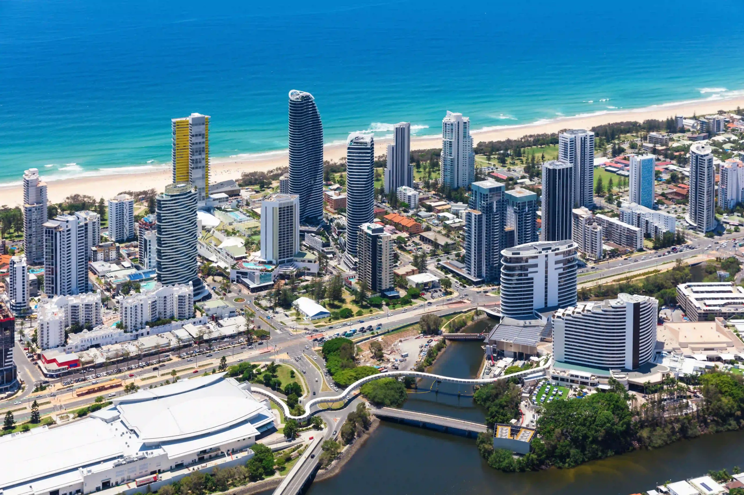 Aerial view of Broadbeach skyline, showcasing residential and commercial buildings near the coast